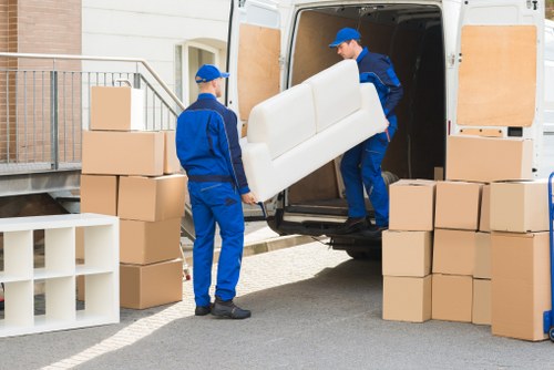 Removal team using protective measures during a house move