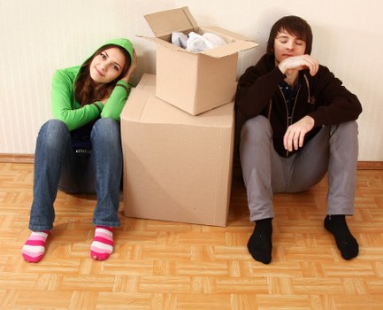 Removal team handling boxed household items during a booked move
