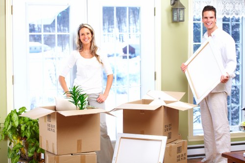 Professional team completing furniture pick-up in Roehampton